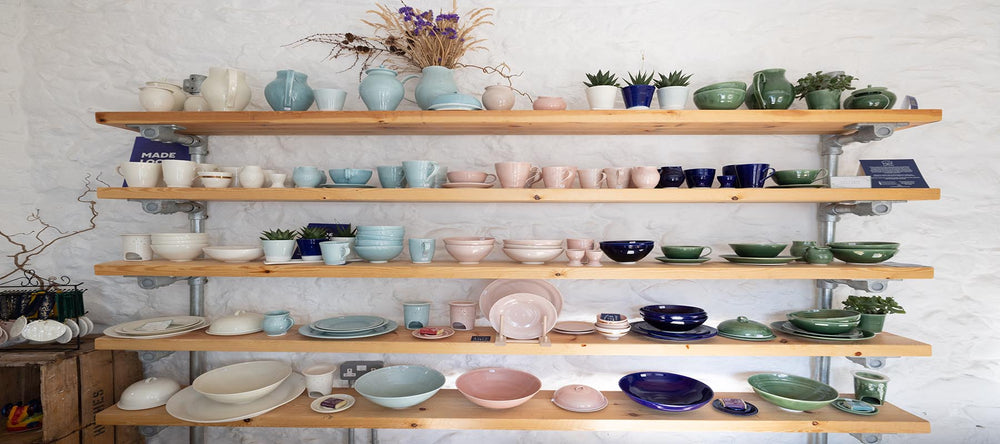 The Blackheath Pottery Shop shelves filled with handmade porcelain pottery glazed in 5 fresh colours, Whole Milke White, Celadon Blue, Blush Pink, Cobalt Blue, Moss Green